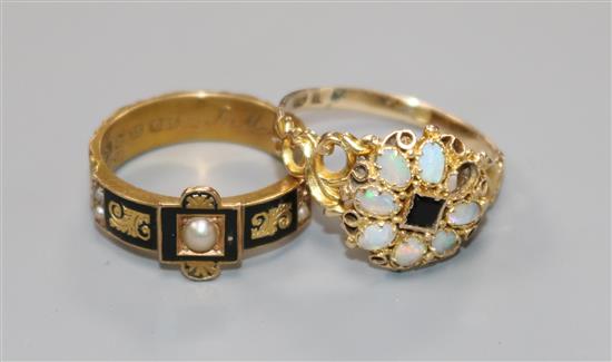 A late Victorian 15ct gold and black enamel mourning ring and an Edwardian 15ct gold, white opal and black onyx cluster ring